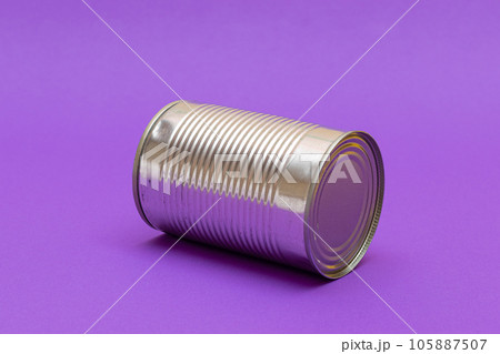 Unopened Tin Can with Blank Edge on Violet Background Unopened Tin Can with Blank Edge on Violet Background 105887507