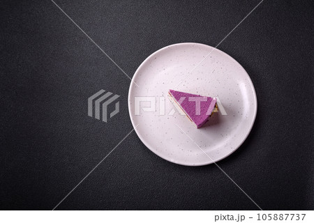 Delicious fresh sweet mousse cake with berry filling Delicious fresh sweet mousse cake with berry filling 105887737
