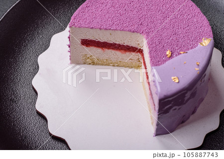 Delicious fresh sweet mousse cake with berry filling Delicious fresh sweet mousse cake with berry filling 105887743