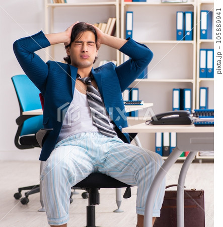 Employee coming to work straight from bed 105889941