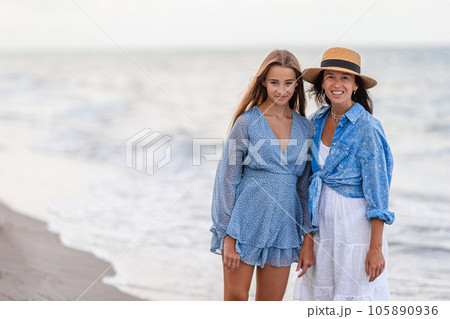 Beautiful mother and daughter at Carribean beach enjoying summer vacation 105890936