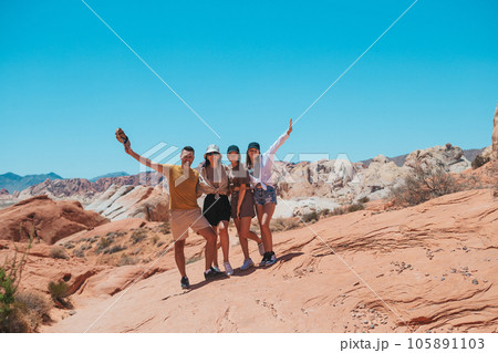 Family on trail at Fire Valley in Utah 105891103