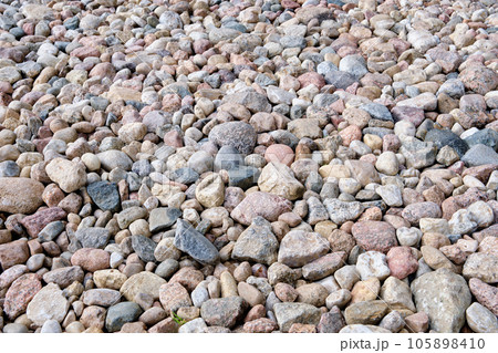River stones laid out next to each other 105898410