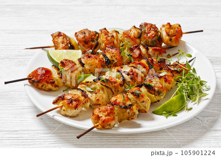 chicken souvlaki with thyme and lime on plate chicken souvlaki with thyme and lime on plate 105901224