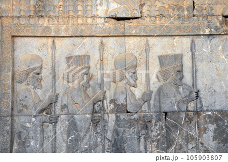 Ancient wall with bas-relief with four assyrian warriors with spears, Persepolis, Iran. UNESCO world heritage site Ancient wall with bas-relief with four assyrian warriors with spears, Persepolis, Iran. UNESCO world heritage site 105903807