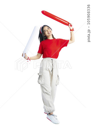 Indonesian girl supporting Indonesian team when competing Indonesian girl supporting Indonesian team when competing 105908336