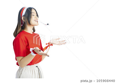 Indonesian girl celebrate Indonesian independence day on 17 August with a marbles race using a spoon 105908440