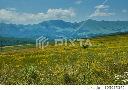Scenic view of green meadows big mountain Dagestan Scenic view of green meadows big mountain Dagestan 105915362