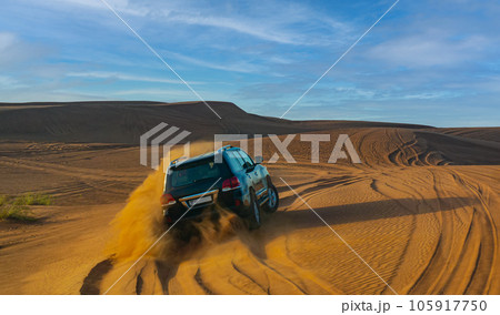 Desert safari on off-road vehicles. Sandy clubs, red-yellow sand. 105917750