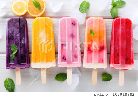 Popsicle on a stick with lime, orange and mint 105918582