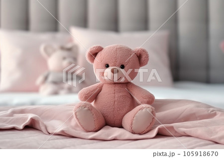Teddy bear sitting on the bed 105918670