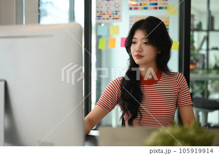 Young graphic designer woman working on workspace. Young graphic designer woman working on workspace. 105919914