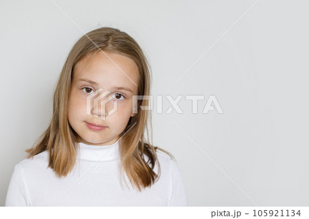Kid girl face closeup. Small girl on white background 105921134