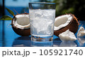 Coconut milk and shells, Glass of coconut water put on wooden background. 105921740