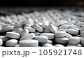 A grayscale shot of white pills sit on the ground, Medical concept. 105921748