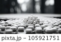 A grayscale shot of white pills sit on the ground, Medical concept. 105921751
