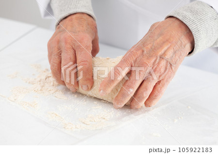 kneading by hand. Home made pizza dough preparation. Pizza preparation. 105922183