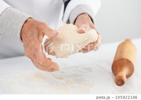 kneading by hand. Home made pizza dough preparation. Pizza preparation. 105922186