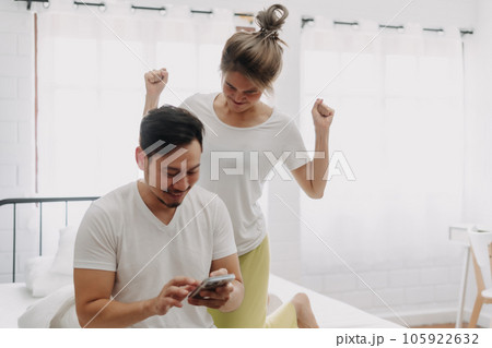 Woman angry on man who keep chatting on the phone. Funny couple fight. Woman angry on man who keep chatting on the phone. Funny couple fight. 105922632