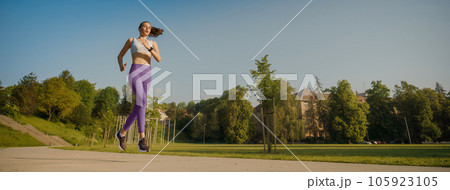Potrait of athletic young woman in activewear running in the city. Potrait of athletic young woman in activewear running in the city. 105923105