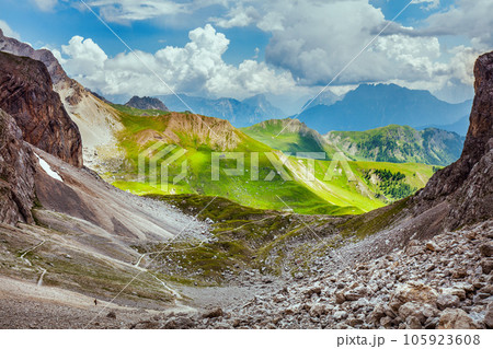 landscape with mountains, hills, clouds and rocks landscape with mountains, hills, clouds and rocks 105923608