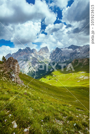 landscape with mountains, hills, clouds and grass 105923615