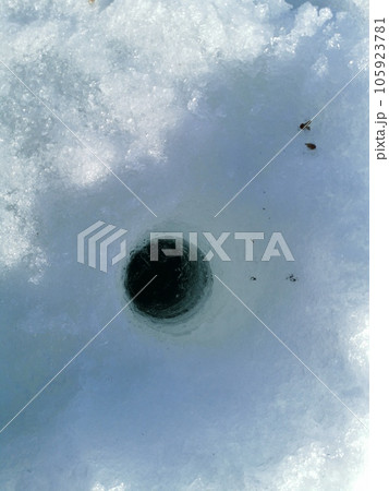 Ice fishing. Winter fishing, catching a fish in the North 105923781