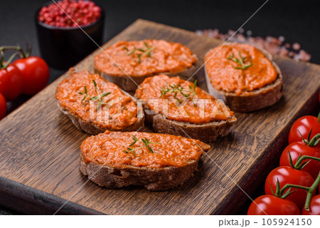 Delicious sandwich consisting of toast, red sauce with salt, spices and herbs Delicious sandwich consisting of toast, red sauce with salt, spices and herbs 105924150