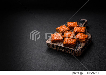 Delicious sandwich consisting of toast, red sauce with salt, spices and herbs Delicious sandwich consisting of toast, red sauce with salt, spices and herbs 105924186