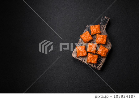 Delicious sandwich consisting of toast, red sauce with salt, spices and herbs Delicious sandwich consisting of toast, red sauce with salt, spices and herbs 105924187