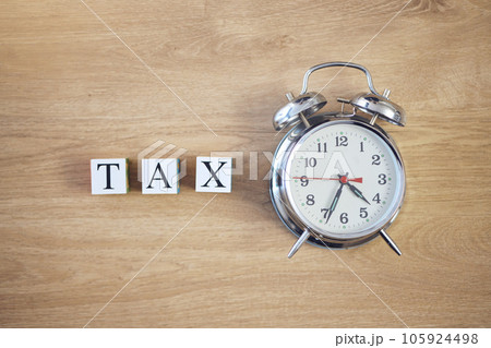 Taxes, clock and finance with building blocks on table from above for planning, future and investment. Budget, payment and accounting with message and alarm for time, income and economy mockup Taxes, clock and finance with building blocks on table from above for planning, future and investment. Budget, payment and accounting with message and alarm for time, income and economy mockup 105924498