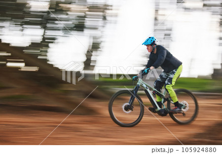 Bike, man and speed with motion blur in forest for sport, race or adventure in summer, woods or nature. Extreme fast cycling, person and action on trail, workout or challenge for fitness with freedom Bike, man and speed with motion blur in forest for sport, race or adventure in summer, woods or nature. Extreme fast cycling, person and action on trail, workout or challenge for fitness with freedom 105924880