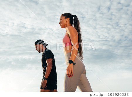 Low-angle shot of two athletes preparing to run outdoors Low-angle shot of two athletes preparing to run outdoors 105926388