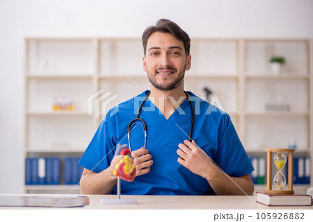 Young male doctor cardiologist working in the clinic 105926882