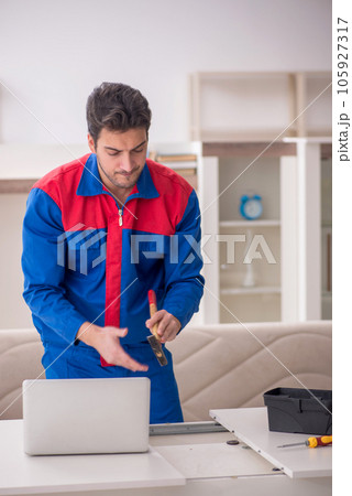 Young male carpenter working at home Young male carpenter working at home 105927317