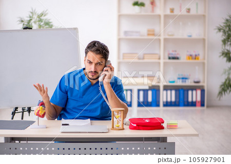Young male doctor in telemedicine concept 105927901
