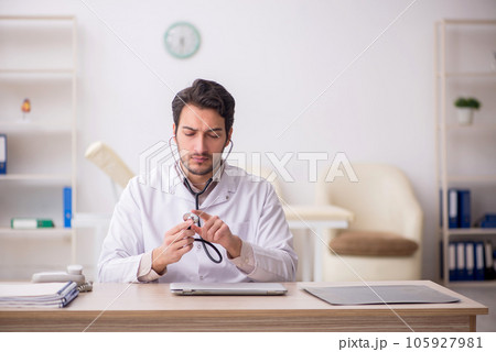 Young male doctor working in the clinic 105927981