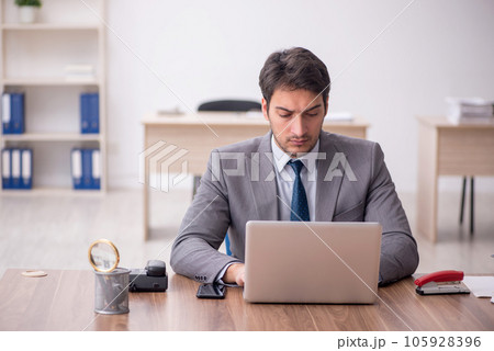 Young male employee working in the office 105928396