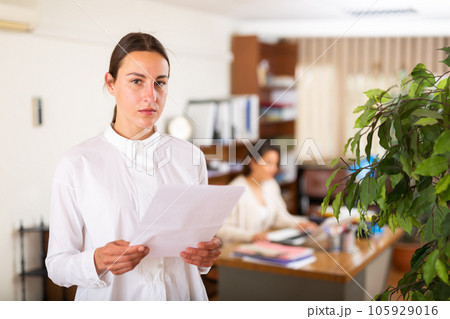 Unhappy female office employee after reprimand from angry chief Unhappy female office employee after reprimand from angry chief 105929016