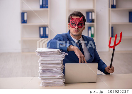 Devil businessman and too much work in the office 105929237