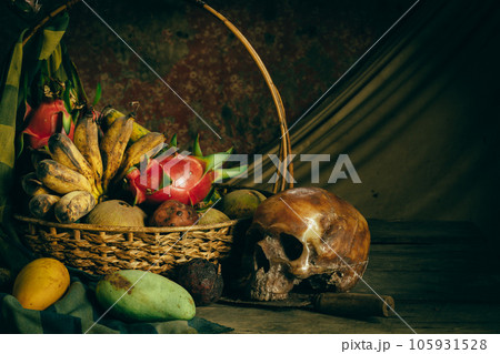 Human skulls and fruit in the basket, wood and old vases on wood, still life concepts 105931528