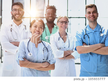 multinational group of doctors and interns standing together. multinational group of doctors and interns standing together. 105933777