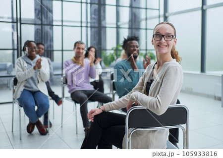 Partial view of business people listening to mentor during business training in office Partial view of business people listening to mentor during business training in office 105933816