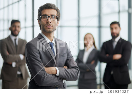 Line of serious multiethnic business man and women looking at camera. 105934327
