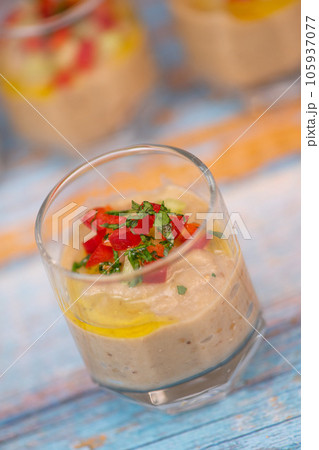 Delicious aubergine caviar verrine on blue background Delicious aubergine caviar verrine on blue background 105937077