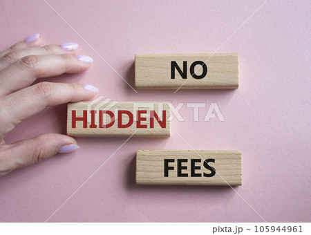 No Hidden Fees symbol. Concept words No Hidden Fees on wooden blocks. Businessman hand. Beautiful pink background. Business and No Hidden Fees concept. Copy space. 105944961