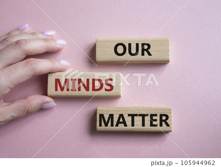 Our Minds Matter symbol. Concept words Our Minds Matter on wooden blocks. Doctor hand. Beautiful pink background. Psychological social and Our Minds Matter concept. Copy space. 105944962