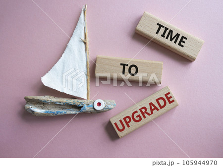 Time to Upgrade symbol. Concept words Time to Upgrade on wooden blocks. Beautiful pink background with boat. Business and Time to Upgrade concept. Copy space. Time to Upgrade symbol. Concept words Time to Upgrade on wooden blocks. Beautiful pink background with boat. Business and Time to Upgrade concept. Copy space. 105944970