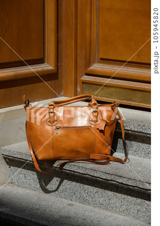 orange female leather bag. street photo orange female leather bag. street photo 105945820