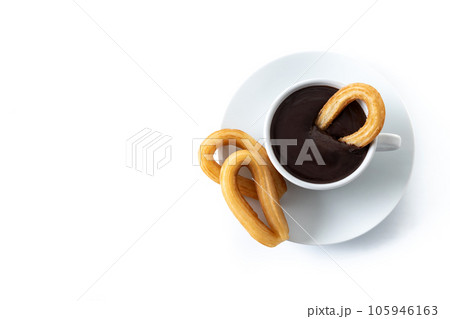 Traditional Spanish churros with hot chocolate isolated on white background Traditional Spanish churros with hot chocolate isolated on white background 105946163